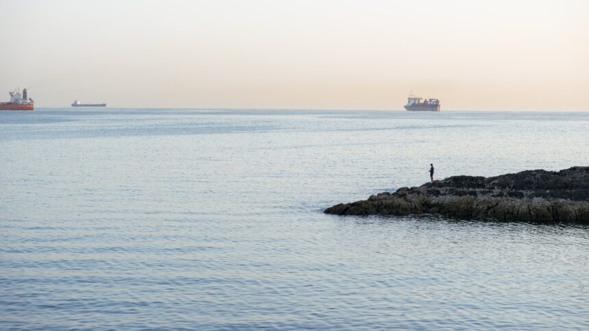 As the United States blocks Iran, its oil continues to flow from ship to ship across the ocean