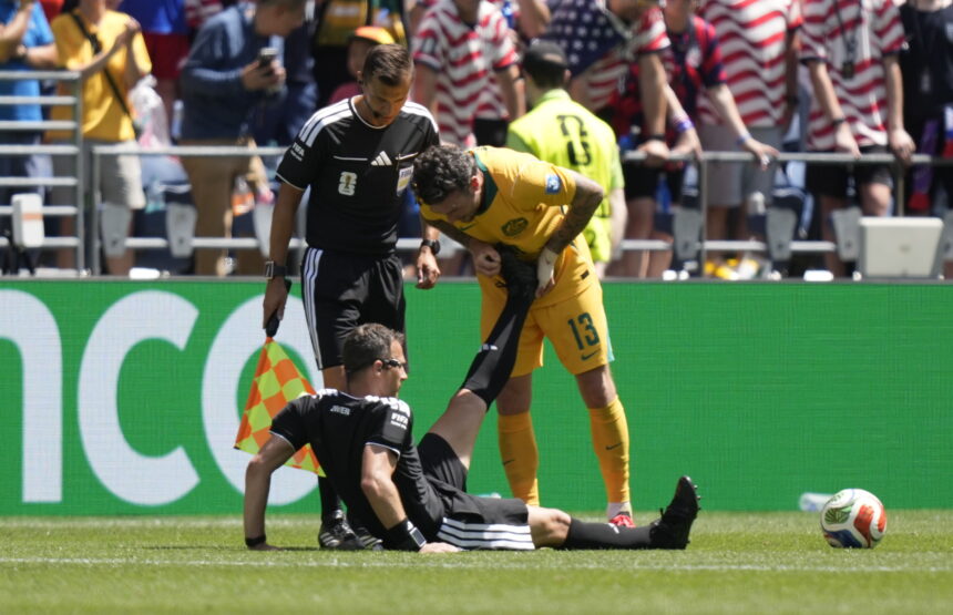 referee Felix Zwayer receives assistance for cramps in the middle of the match