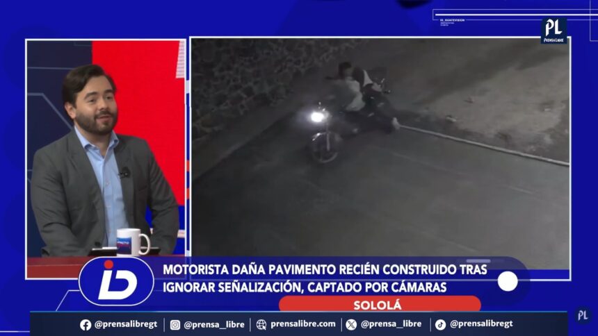 Motorist is recorded while traveling on fresh concrete in Sololá