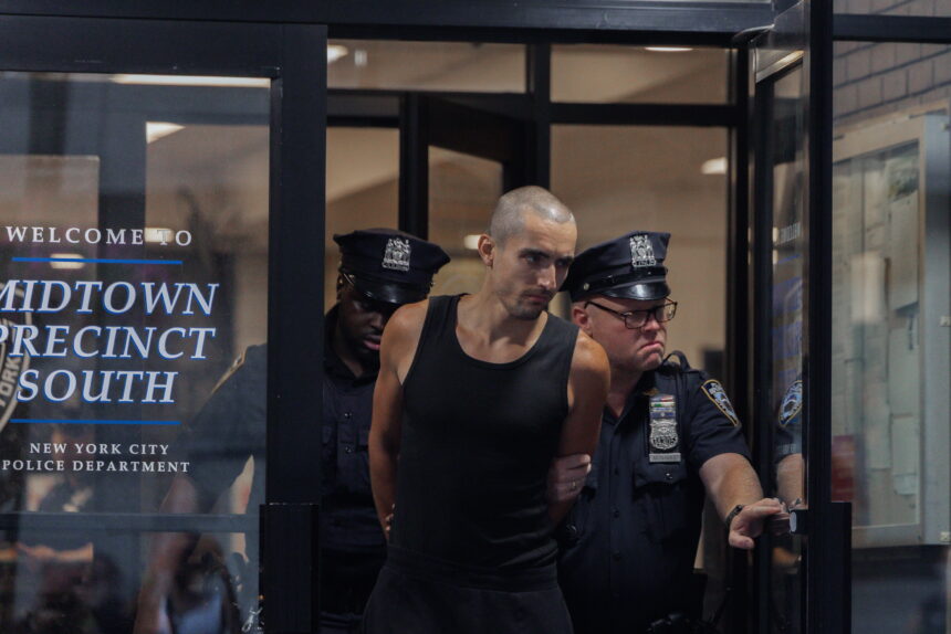 Who is the couple facing eight charges after climbing the Empire State Building?